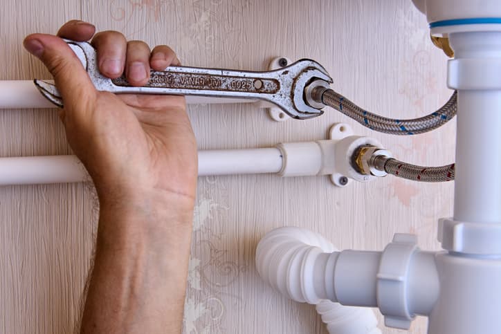 Plumber using wrench